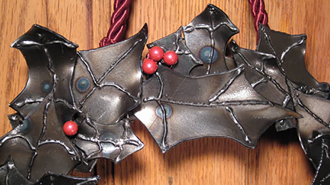 steel holiday wreath with holly