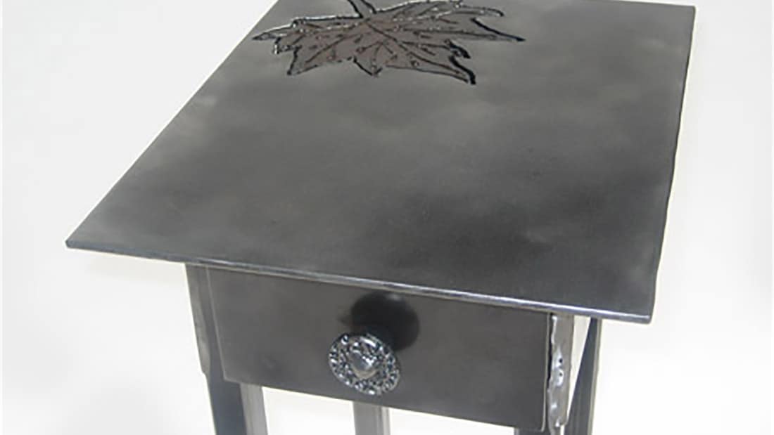 steel side table with leaf design