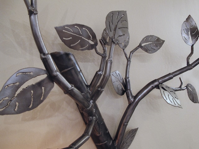 hanging steel light with leaves and branches