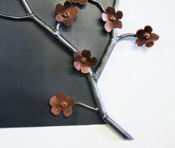 steel artwork with flowers