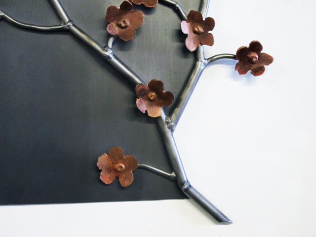 steel artwork with flowers