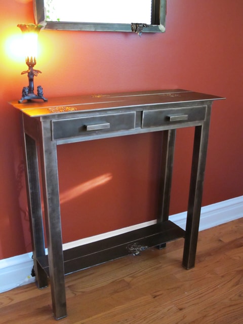 steel console table with leaf design