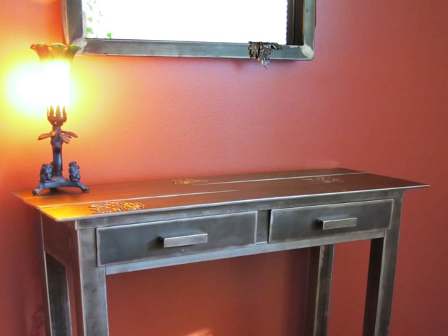 steel console table with leaf design