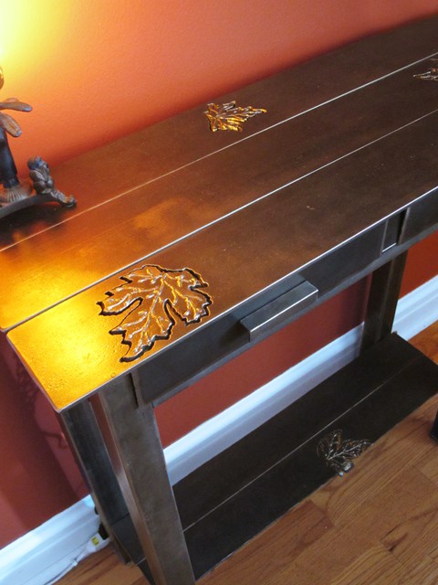 steel console table with leaf design
