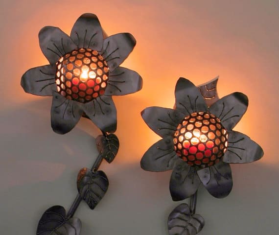 steel sunflower sconces with candles