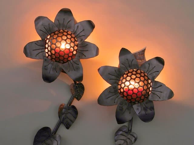 steel sunflower sconces with candles