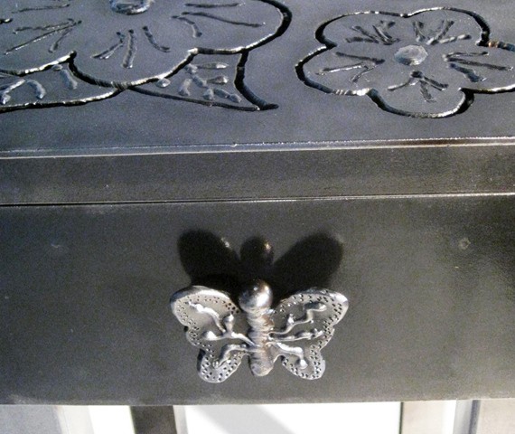 metal end table with flowers